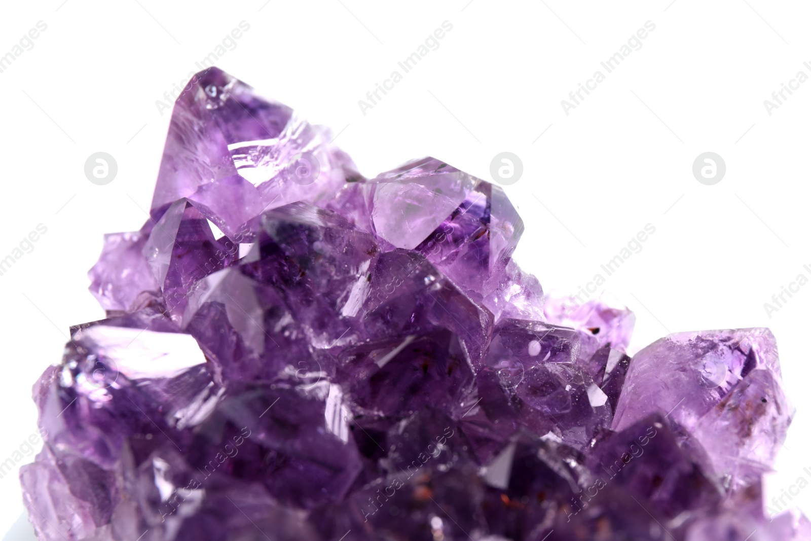 Photo of Beautiful purple amethyst gemstone on white background, closeup