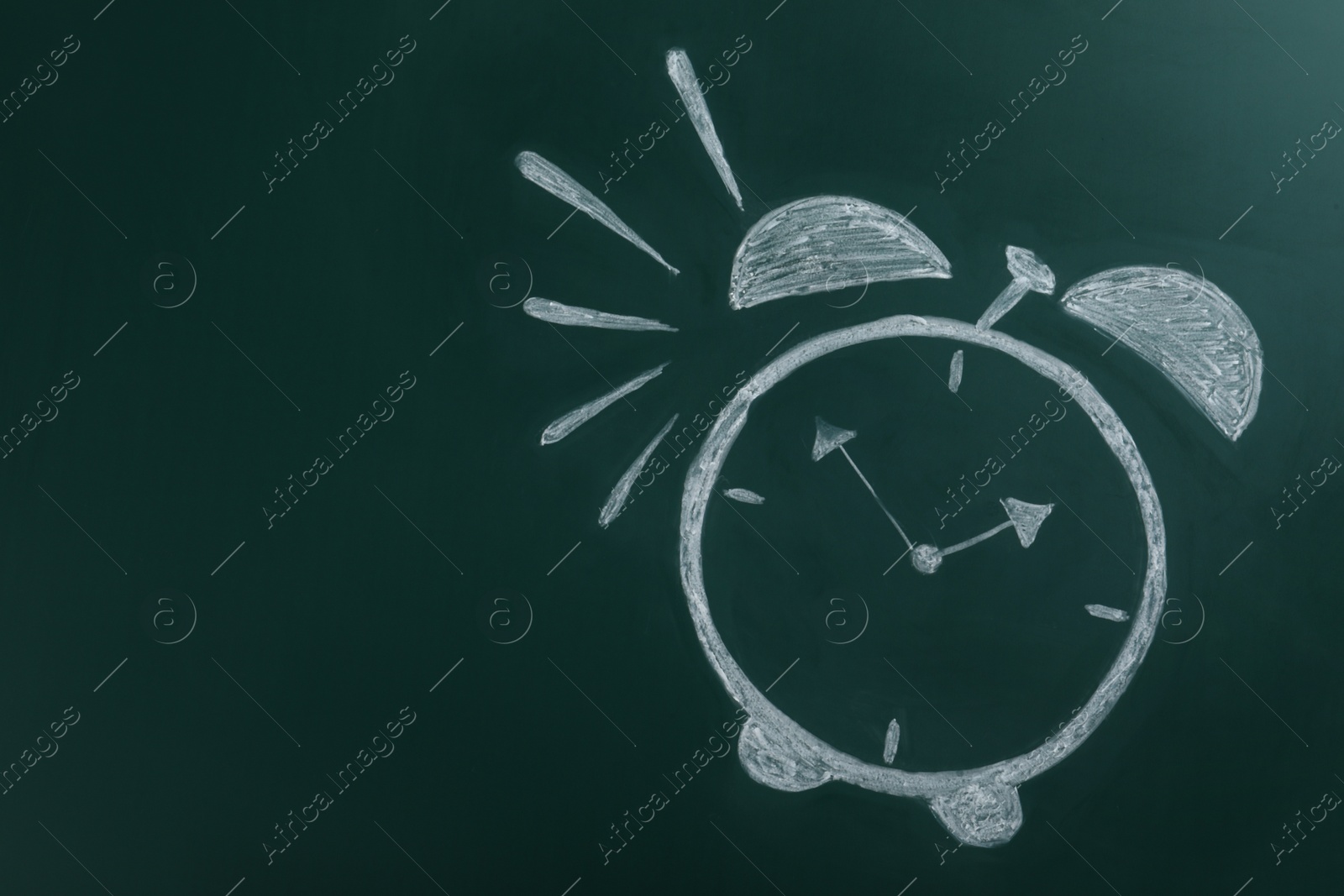 Photo of Alarm clock drawn on green chalkboard, space for text. School time