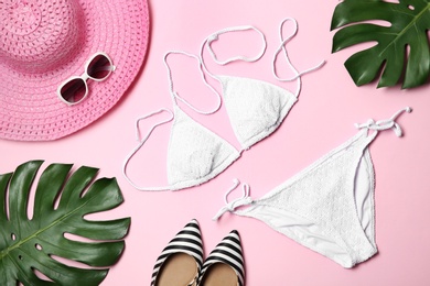 Photo of Flat lay composition with stylish bikini on color background