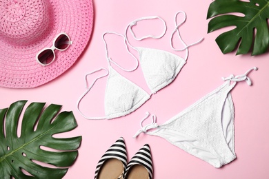 Flat lay composition with stylish bikini on color background