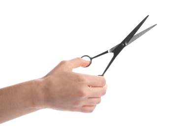 Photo of Woman holding hairdresser's scissors on white background, closeup