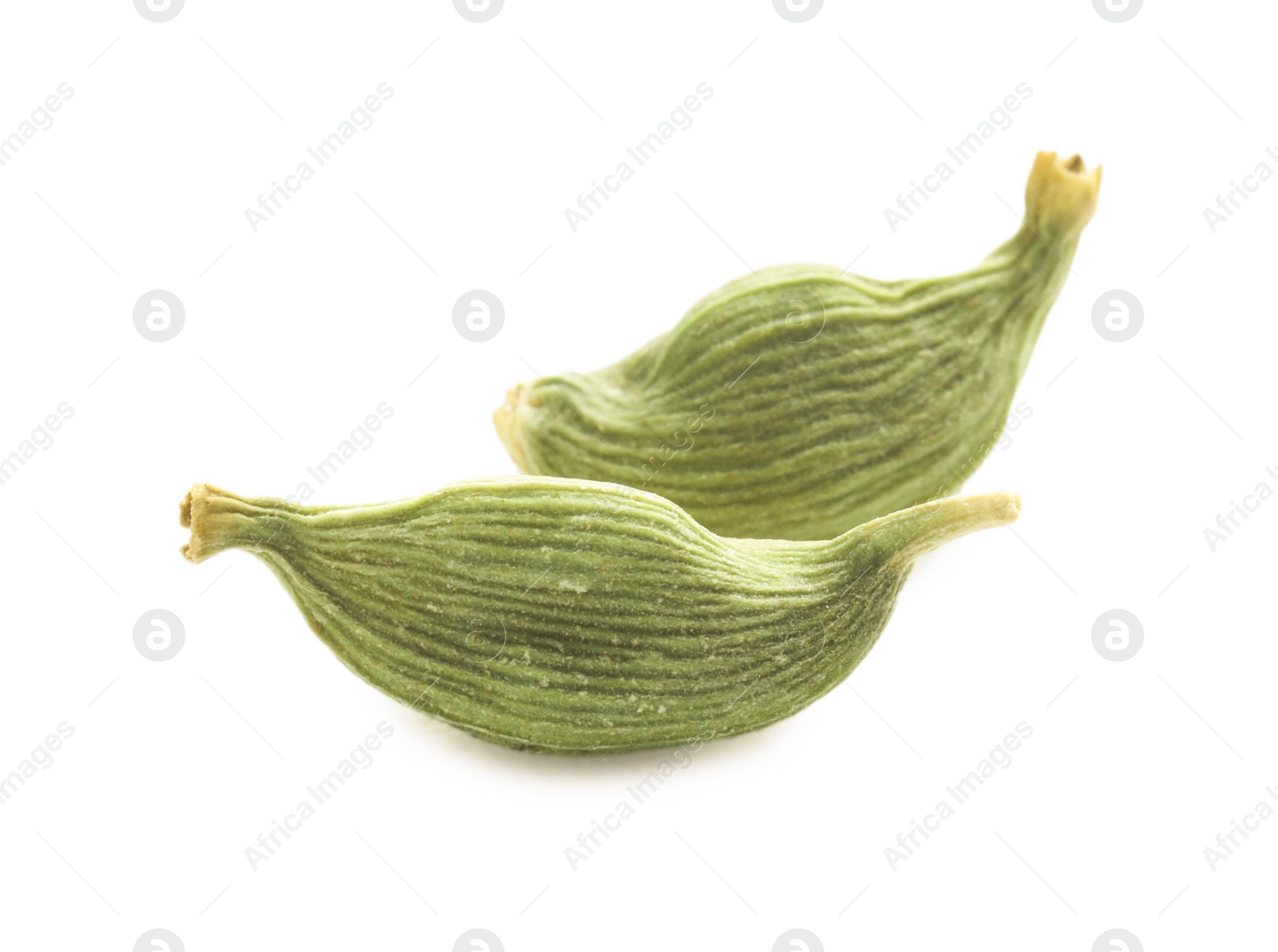 Photo of Dry green cardamom pods on white background, closeup