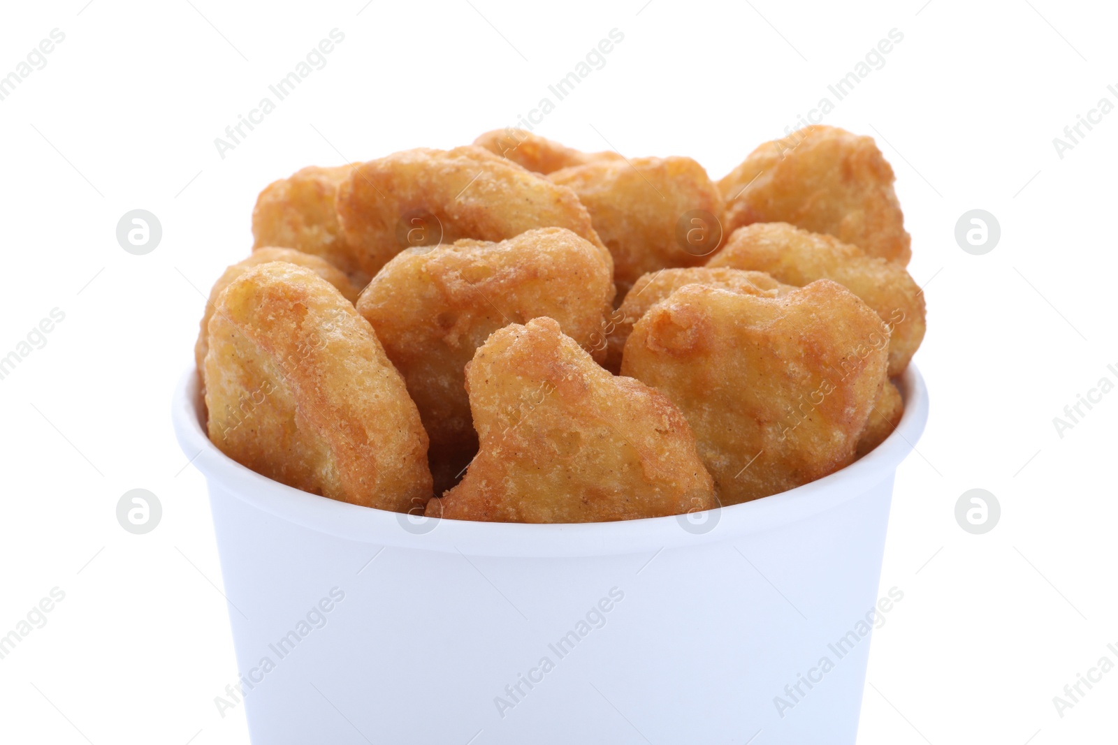 Photo of Bucket with tasty chicken nuggets isolated on white, closeup