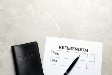 Photo of Referendum ballot with pen and passport on light grey marble table, flat lay. Space for text