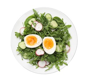 Photo of Delicious salad with boiled egg, vegetables and arugula isolated on white, top view