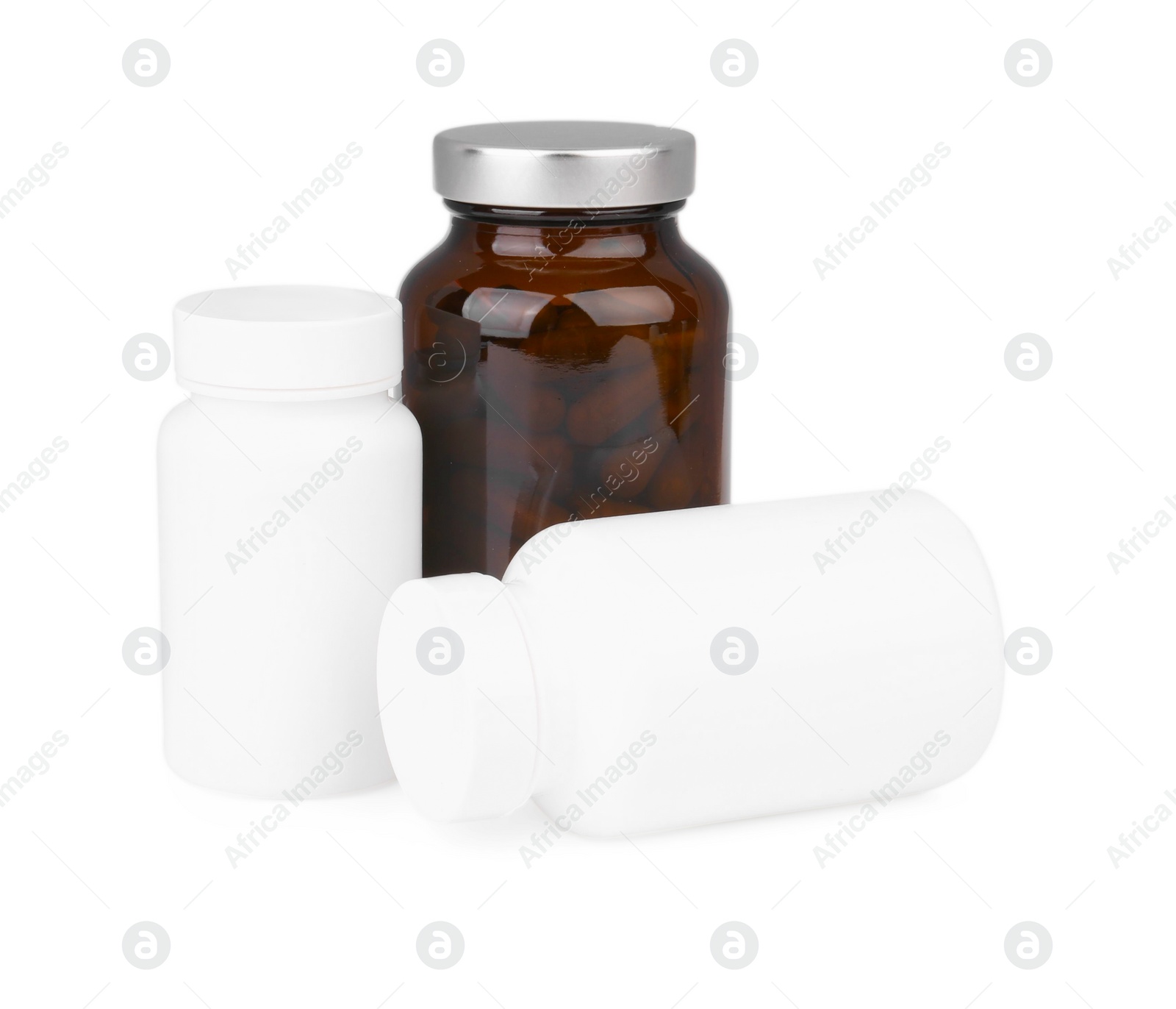 Photo of Bottles with vitamin capsules isolated on white