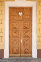 Photo of Building with vintage wooden door. Exterior design