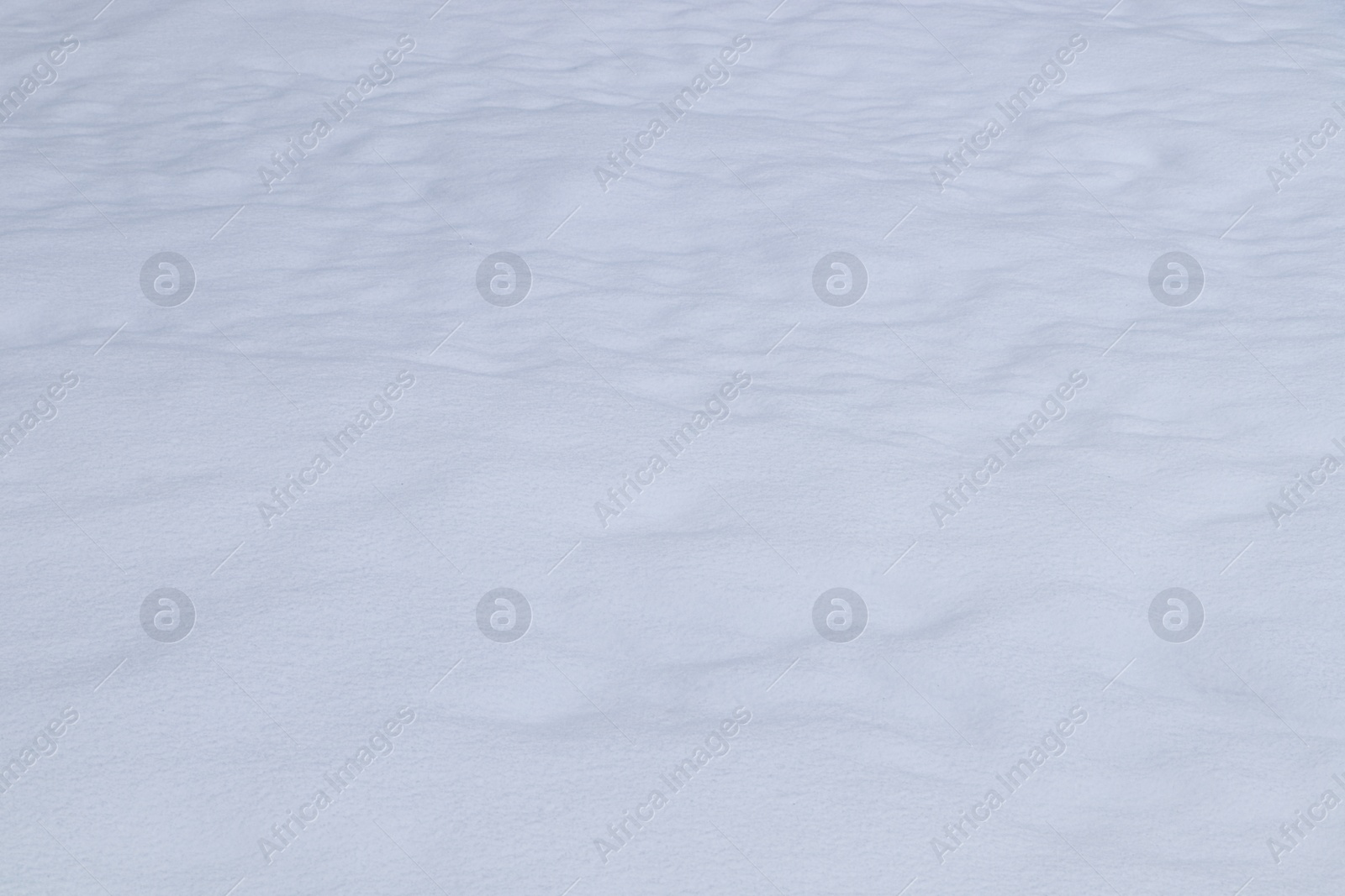 Photo of Beautiful shiny snow as background, closeup view