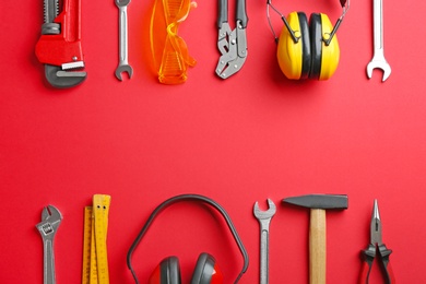 Photo of Flat lay composition with construction tools on color background, space for text