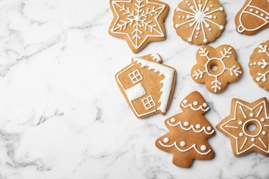 Photo of Tasty homemade Christmas cookies on marble background, top view