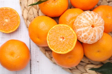 Fresh juicy tangerines on white wooden table, flat lay