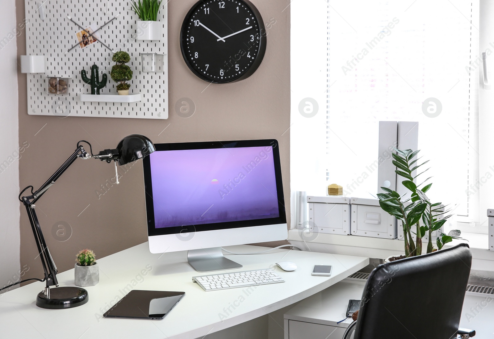 Photo of Stylish workplace with computer on table