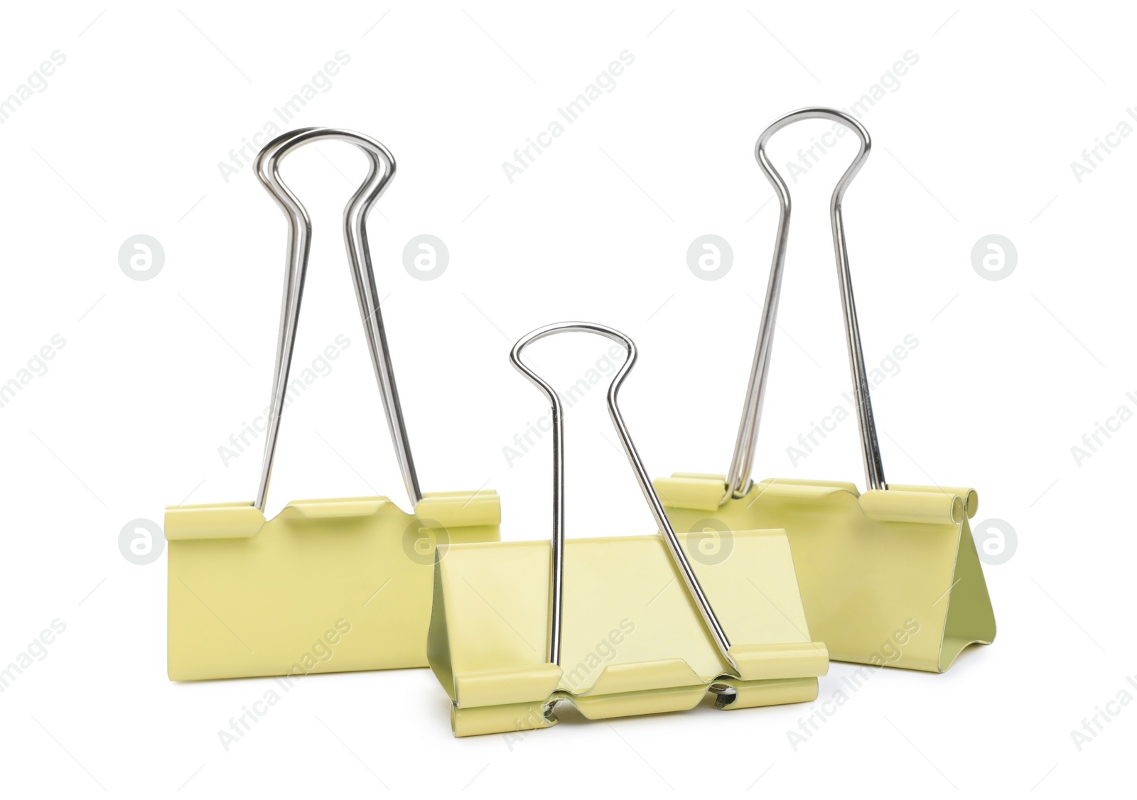 Photo of Yellow binder clips on white background. Stationery item