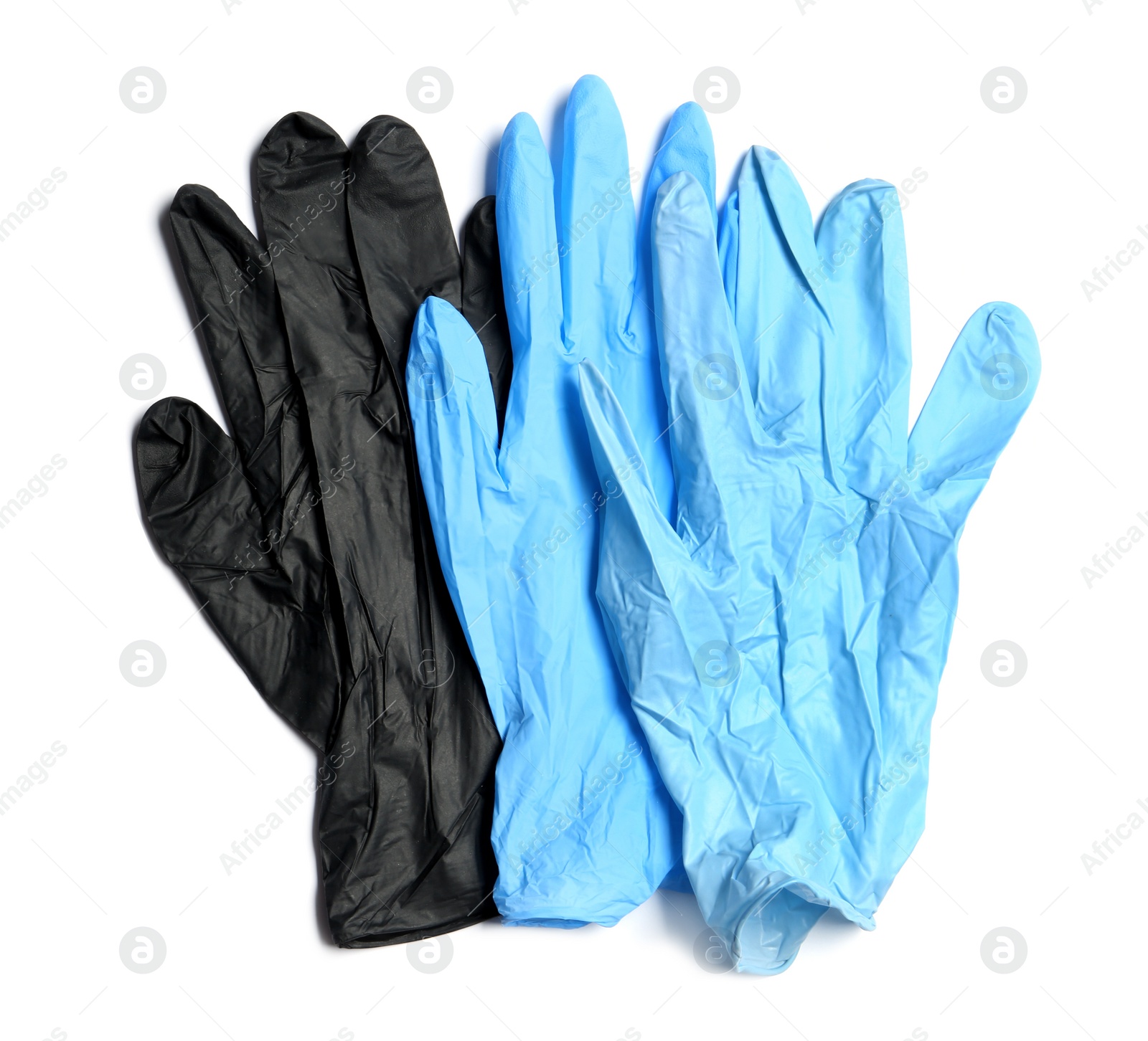 Photo of Different medical gloves on white background, top view