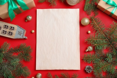 Blank paper with space for text and Christmas decor on red background, flat lay. Letter to Santa Claus