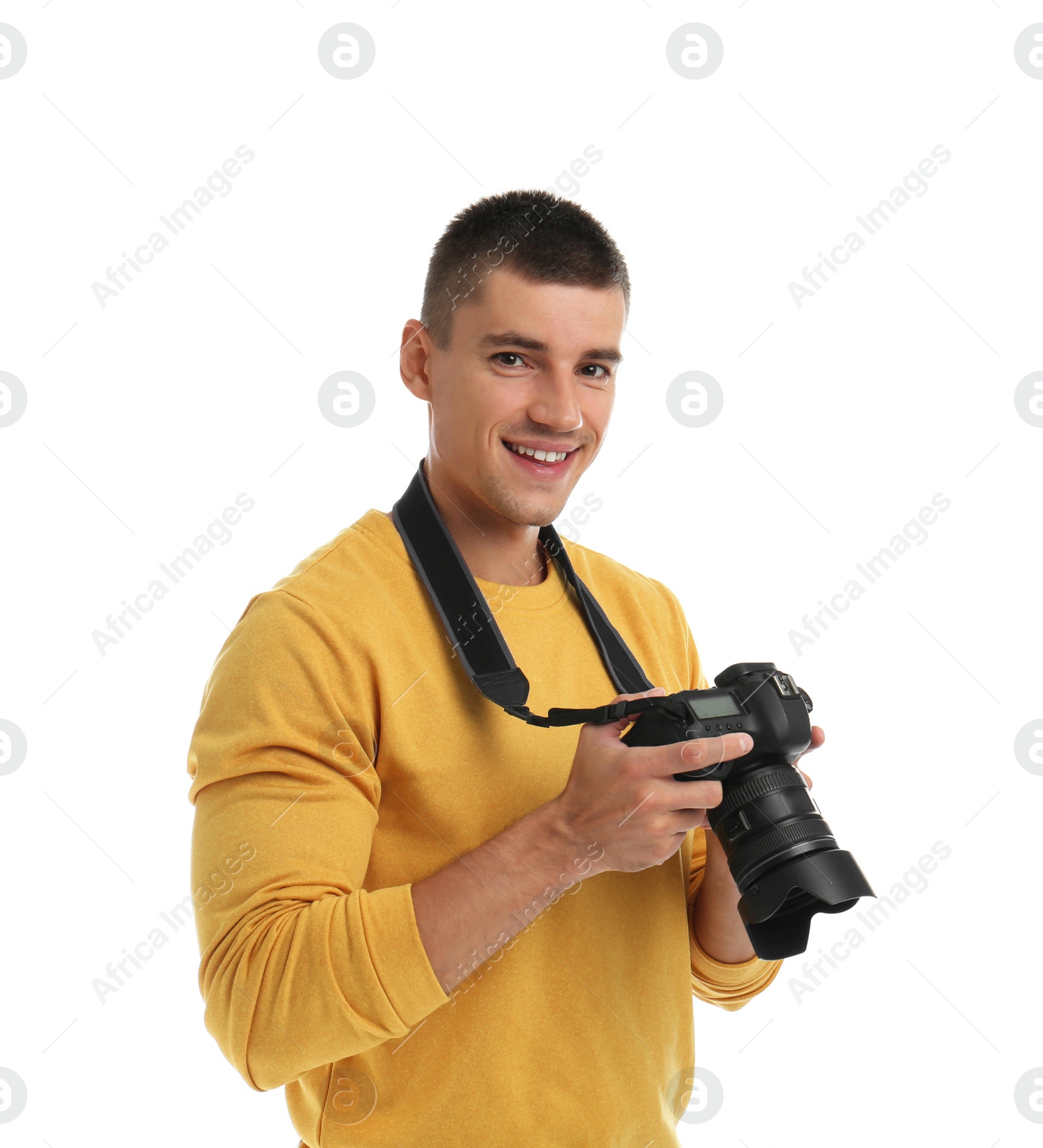 Photo of Young photographer with professional camera on white background