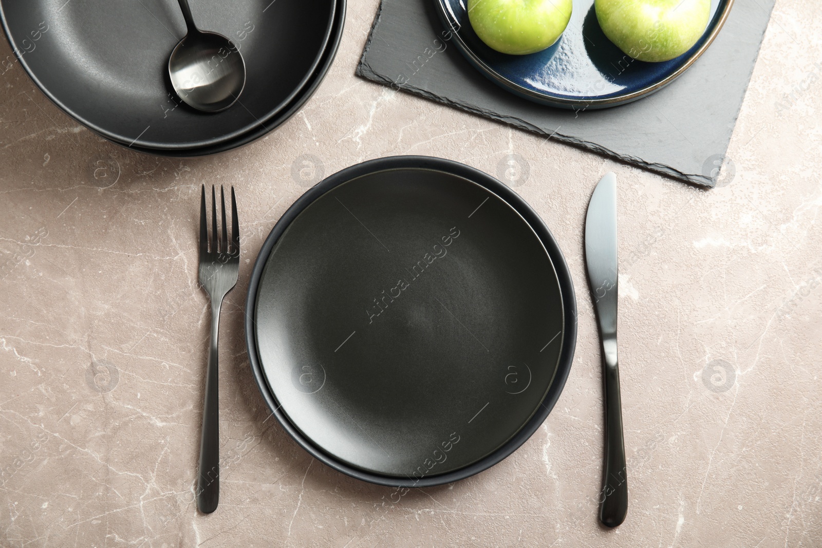 Photo of Set of clean dishware on grey table, flat lay