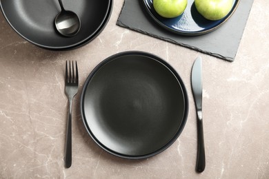 Photo of Set of clean dishware on grey table, flat lay
