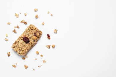 Photo of Tasty granola bar on white background, top view. Space for text