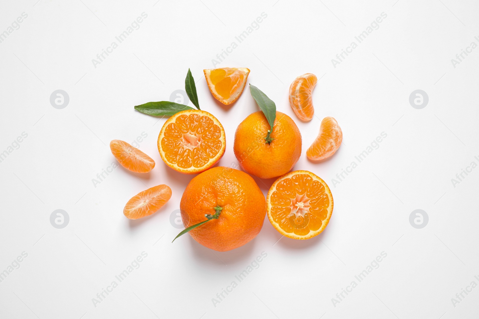 Photo of Composition with fresh ripe tangerines and leaves on white background, flat lay. Citrus fruit