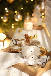 Composition with cup of hot drink on windowsill