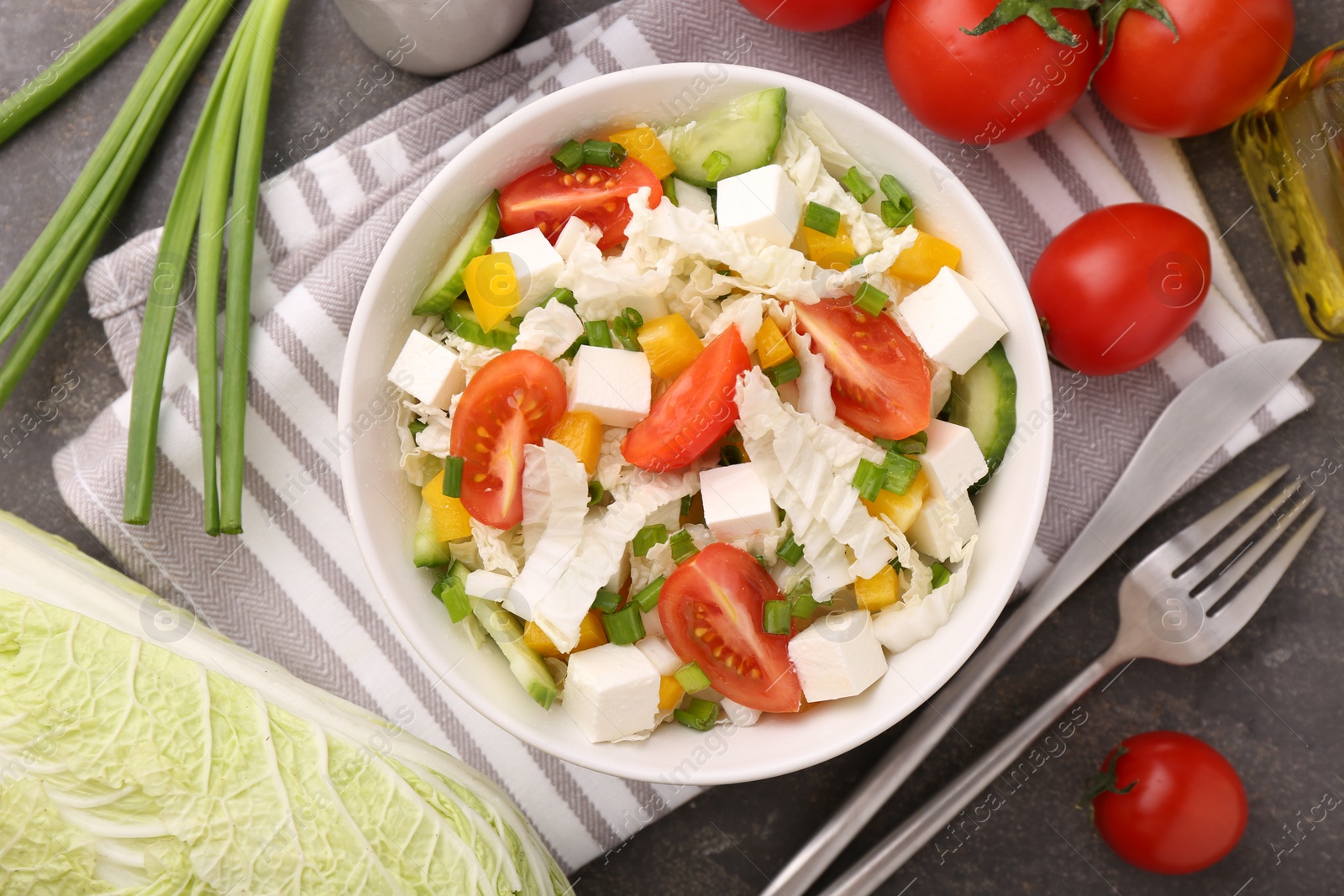 Photo of Tasty salad with Chinese cabbage served on grey table, top view