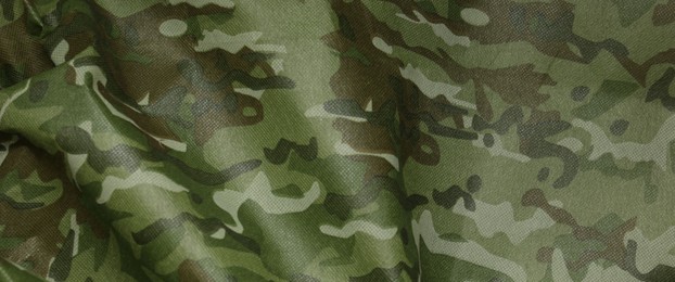 Texture of camouflage fabric as background, top view