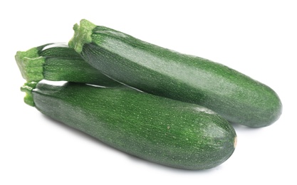 Fresh ripe green zucchinis isolated on white