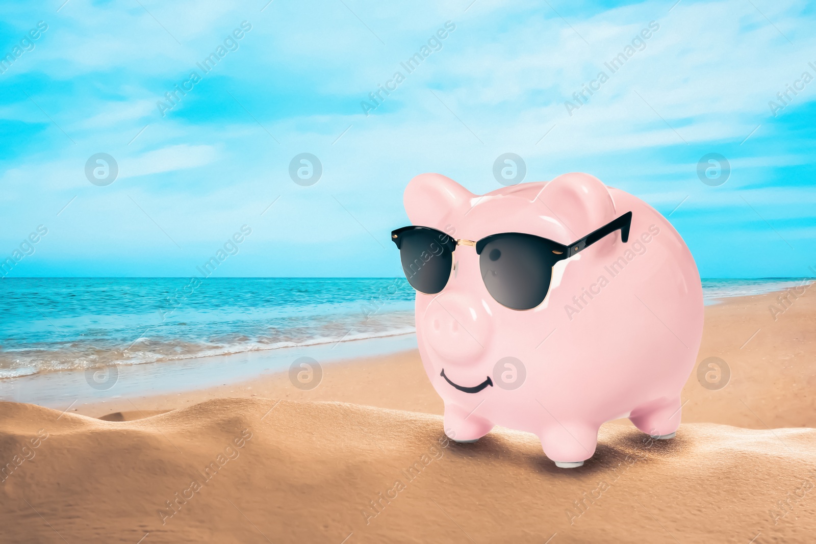 Image of Vacation savings. Piggy bank with sunglasses on sandy beach near sea. Space for text