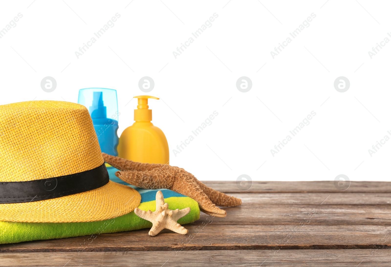 Photo of Set of different beach accessories on table against white background. Space for text