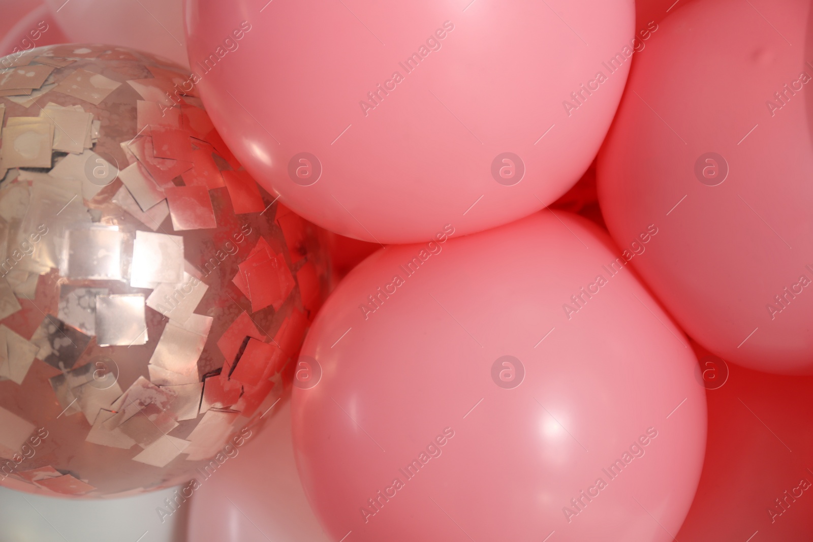 Photo of Beautiful colorful balloons on light background, closeup