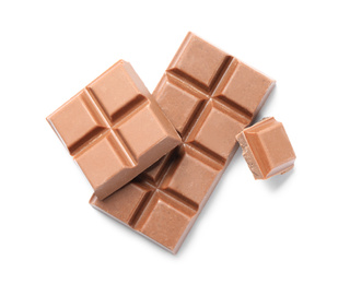 Photo of Pieces of delicious milk chocolate isolated on white, top view