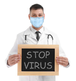 Image of Doctor in medical mask holding chalkboard with text STOP VIRUS on white background