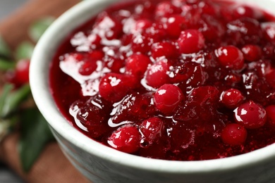 Photo of Delicious fresh cranberry sauce in bowl, closeup