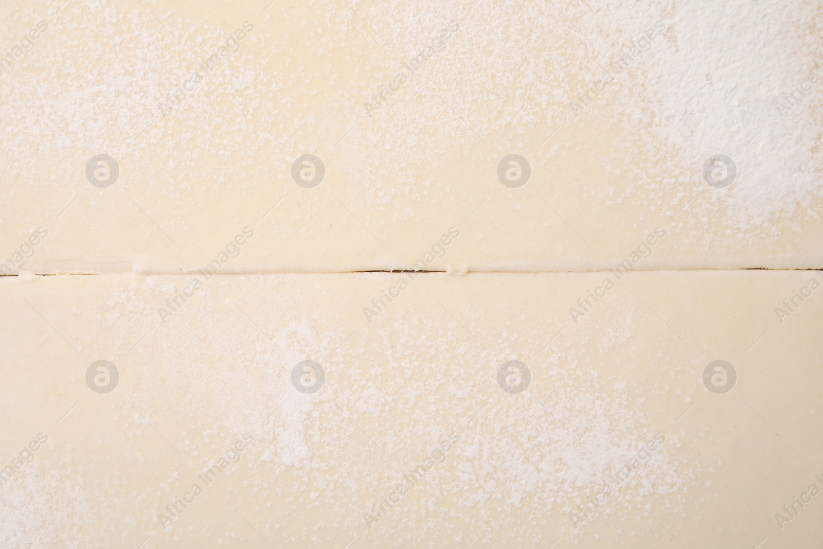 Photo of Raw puff pastry dough as background, top view