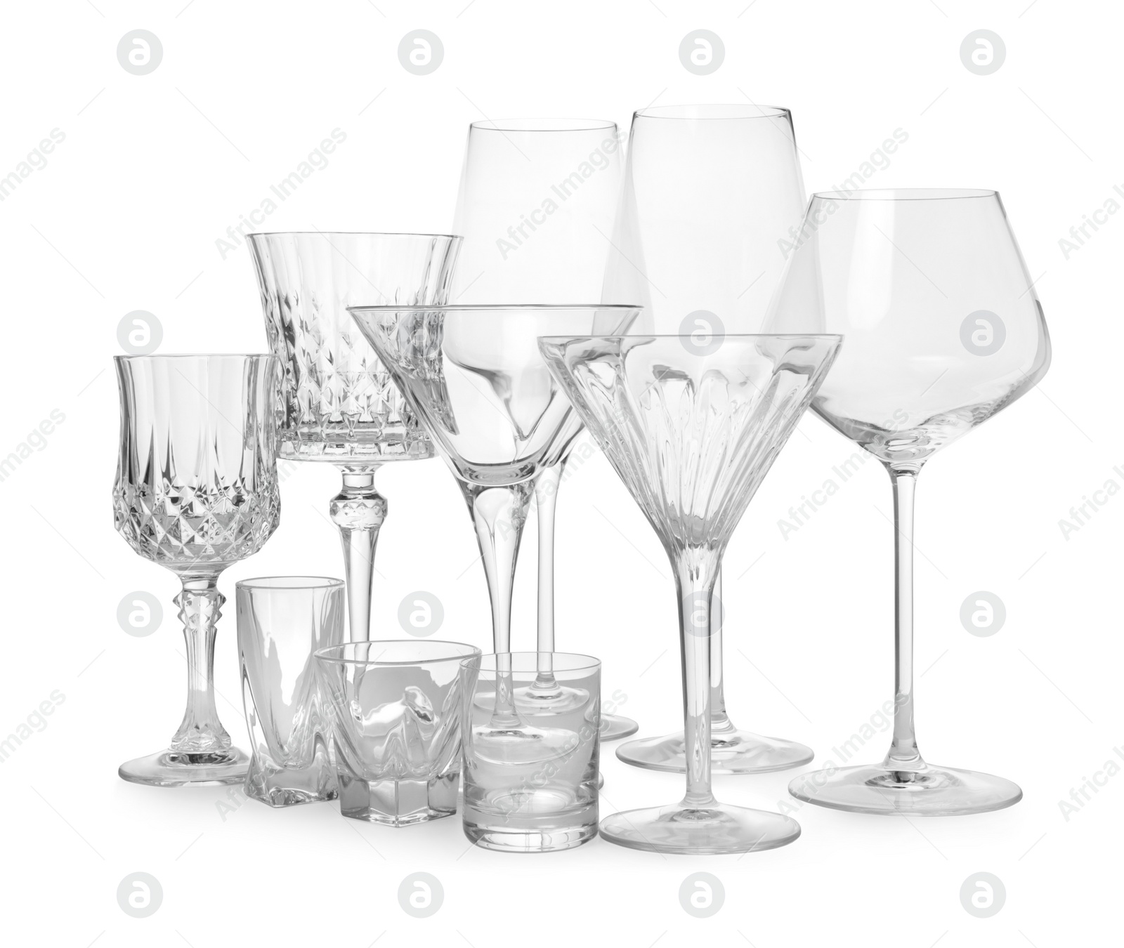 Photo of Different elegant empty glasses isolated on white