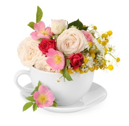 Photo of Aromatic herbal tea in cup with different flowers isolated on white