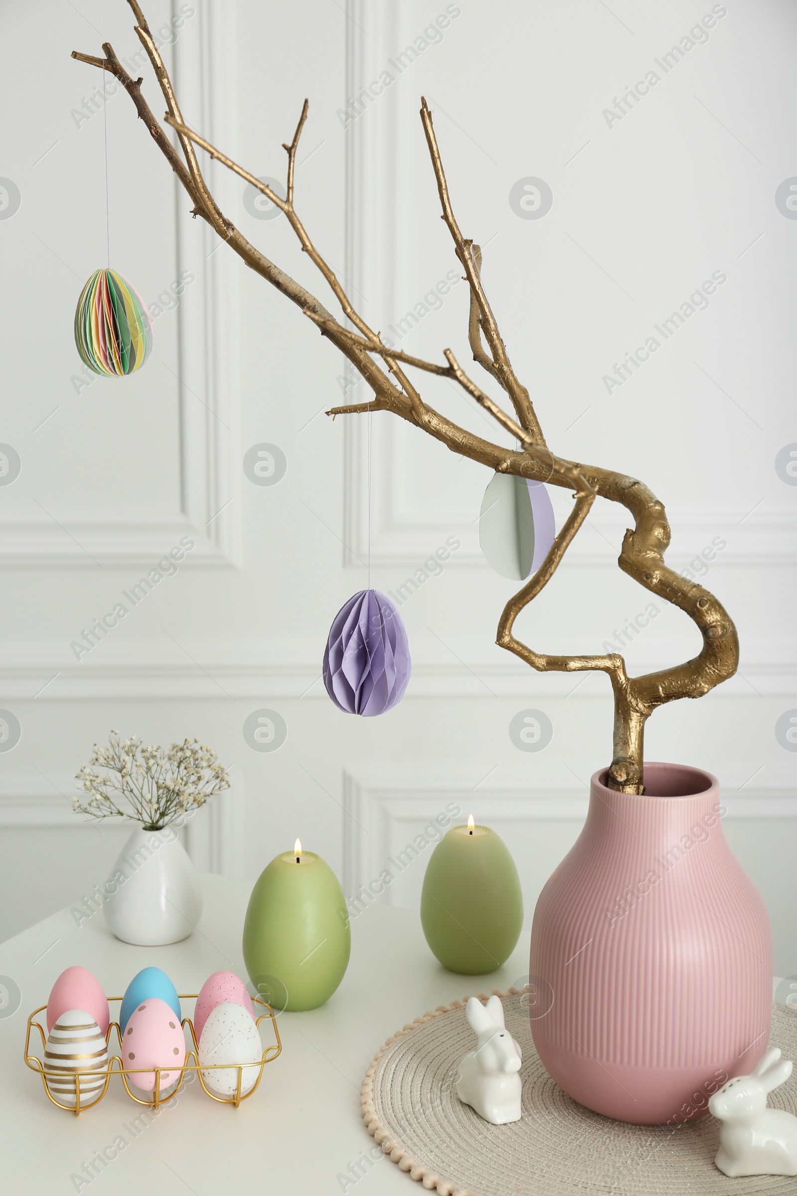 Photo of Beautiful festive composition with Easter decor on white table indoors