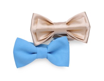 Different stylish bow ties on white background, top view