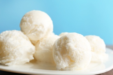 Photo of Plate with tasty vanilla ice cream, closeup