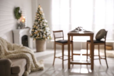 Photo of Blurred view of festive living room interior with Christmas tree