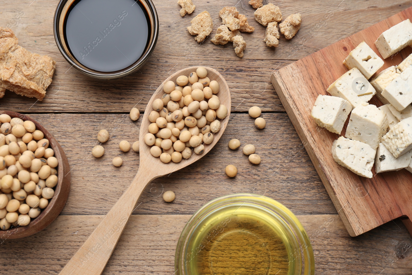 Photo of Different fresh soy products on wooden table, flat lay