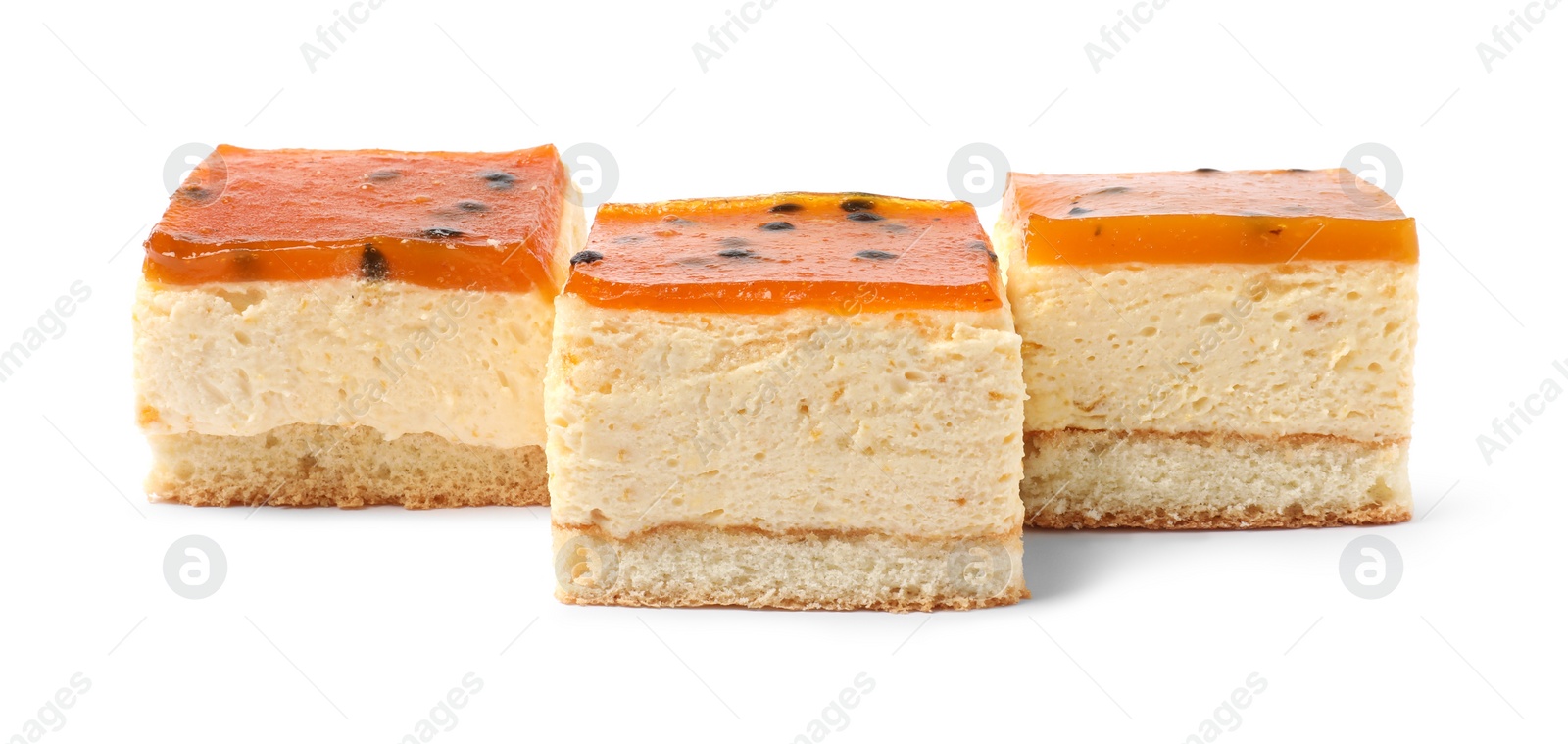 Photo of Pieces of cheesecake with jelly on white background