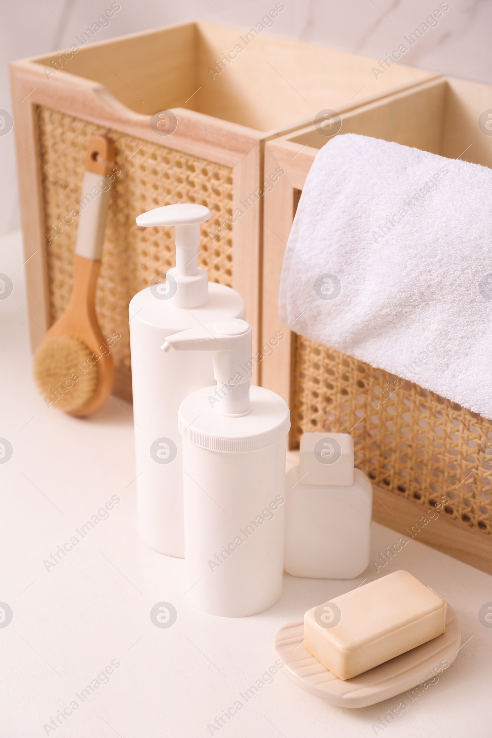 Photo of Toiletries and personal hygiene products on white table in bathroom