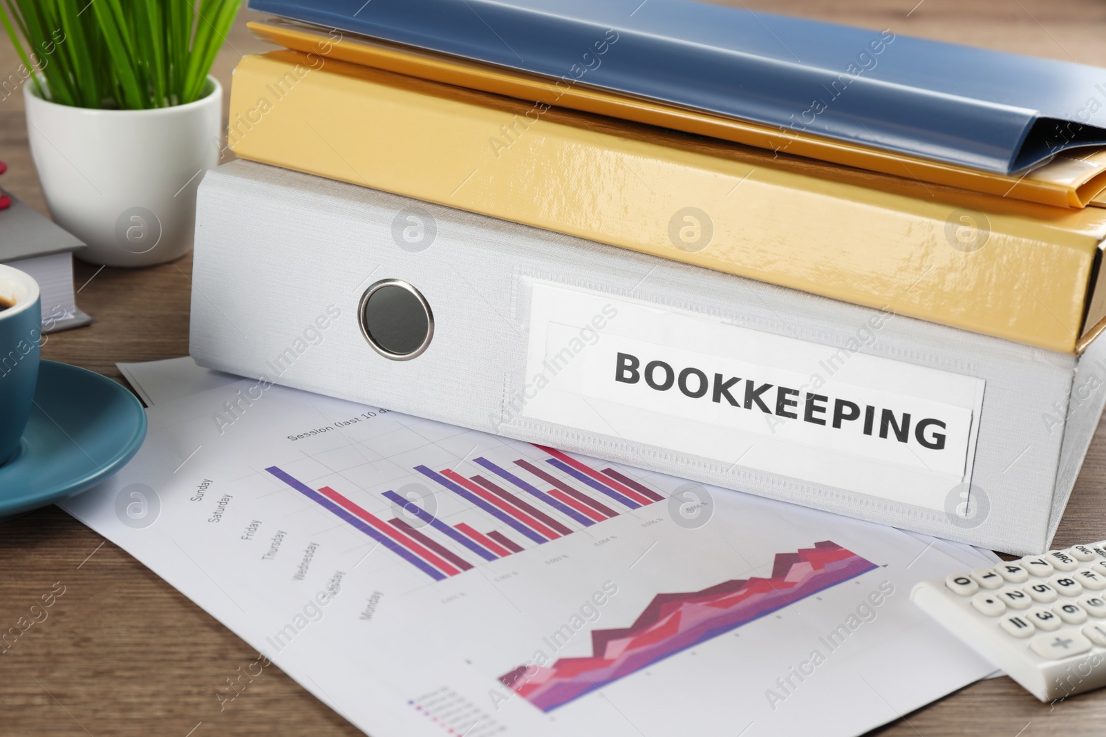 Photo of Folders and documents on desk in office, closeup. Bookkeeper's workplace