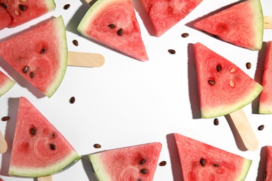 Photo of Frame made with slices of ripe watermelon on white background, flat lay. Space for text