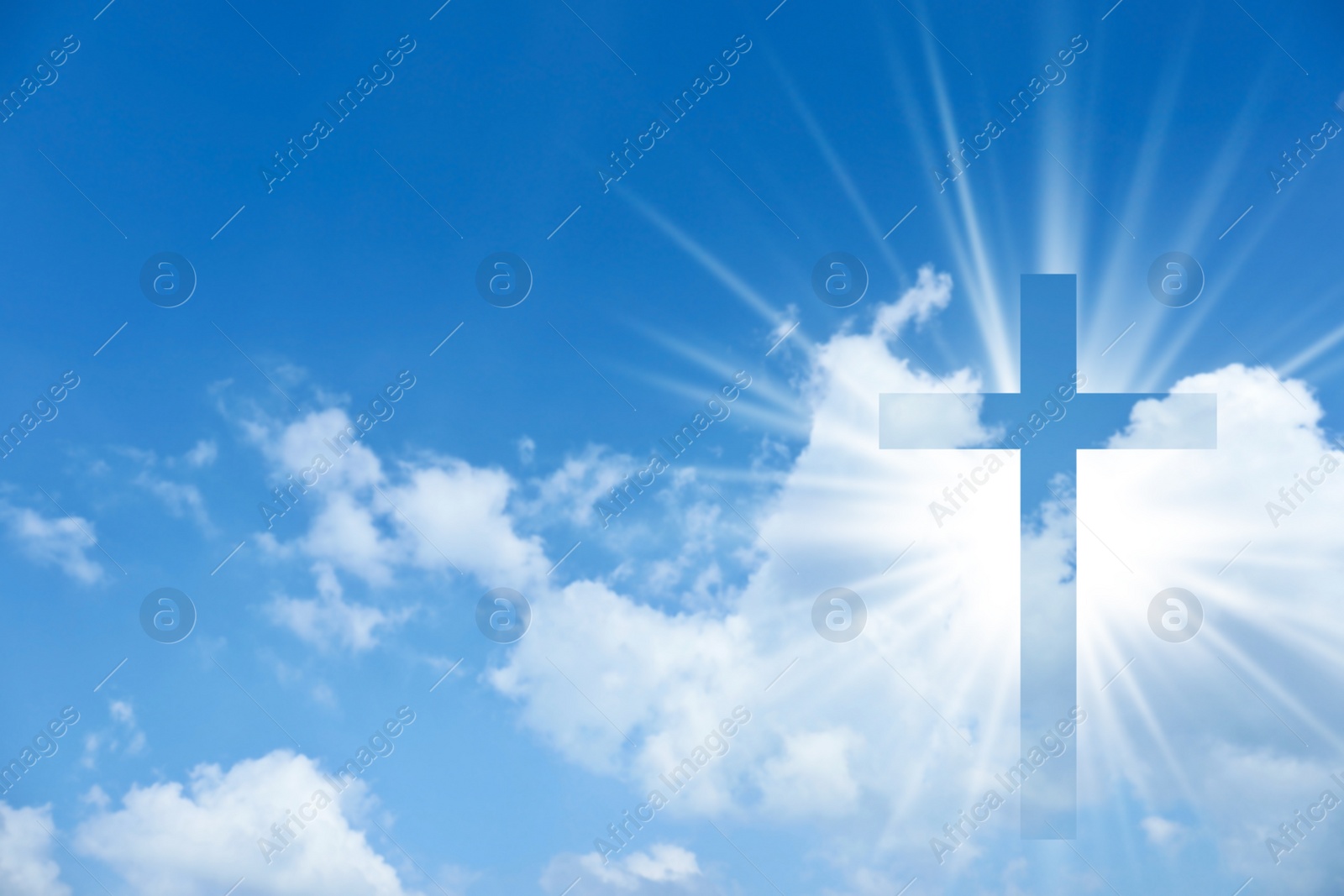 Image of Silhouette of cross against blue sky. Christian religion