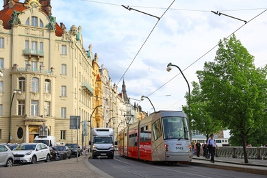 Photo of PRAGUE, CZECH REPUBLIC - APRIL 25, 2019: City street with beautiful buildings and road traffic