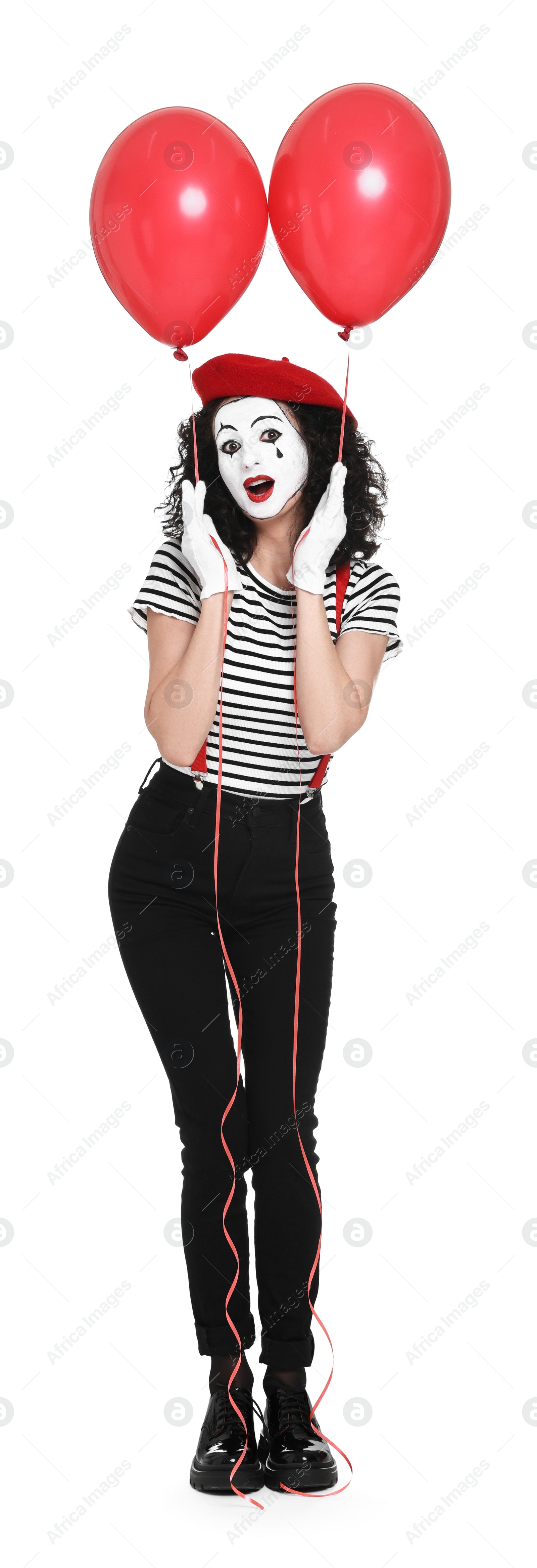 Photo of Funny mime with balloons posing on white background