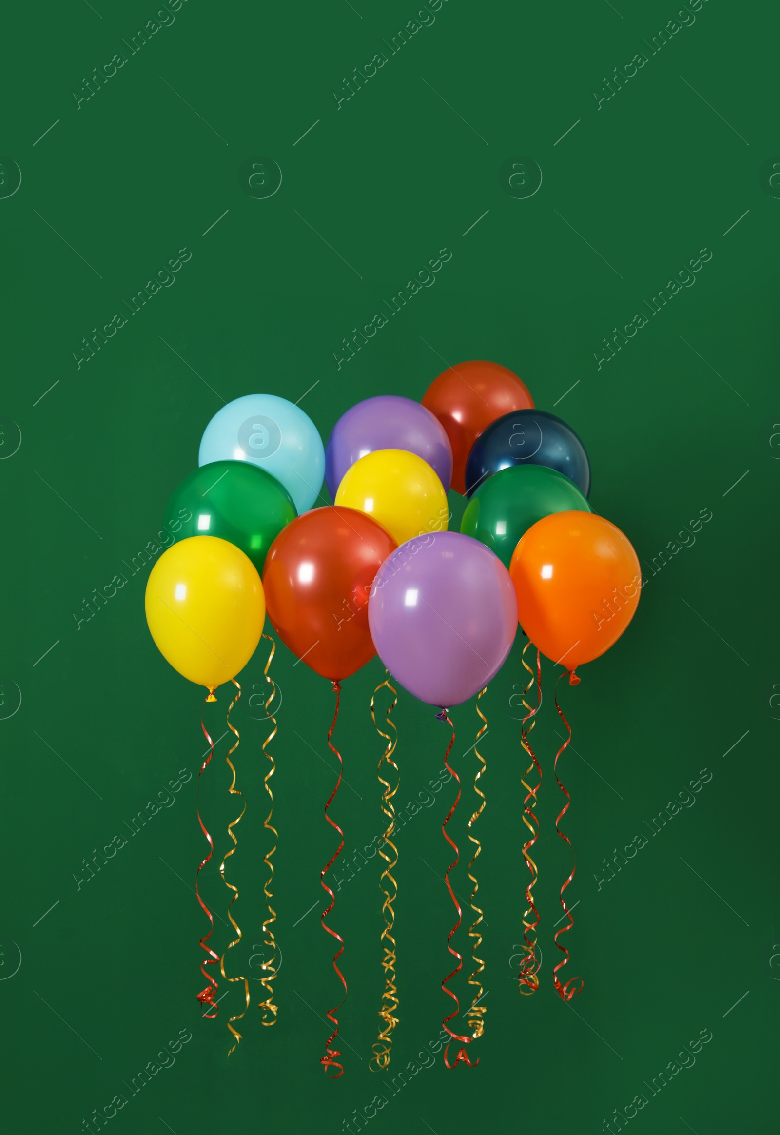 Photo of Bright balloons on color background. Celebration time